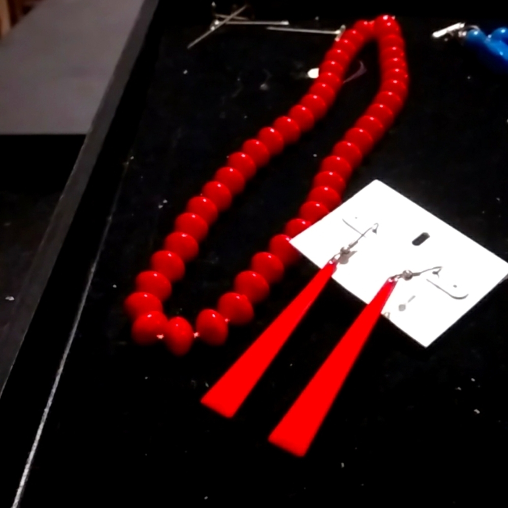 Bright red bead necklace with metal drop earrings